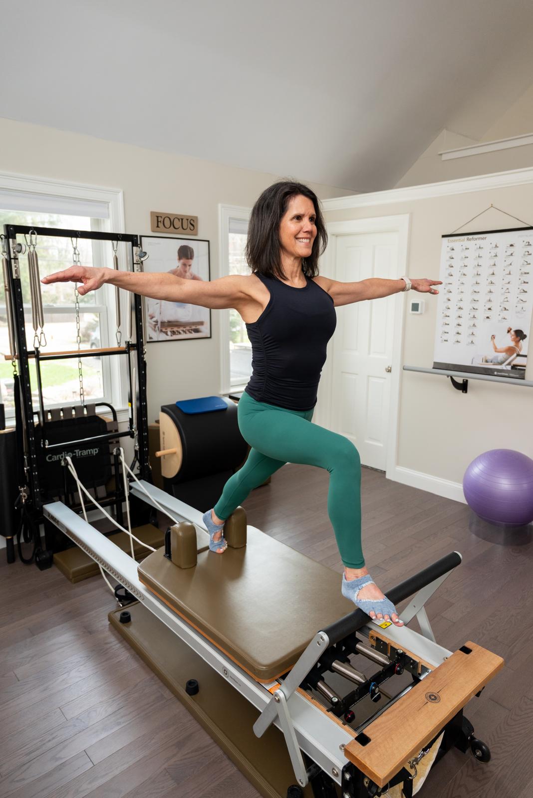 Monica using the reformer machine