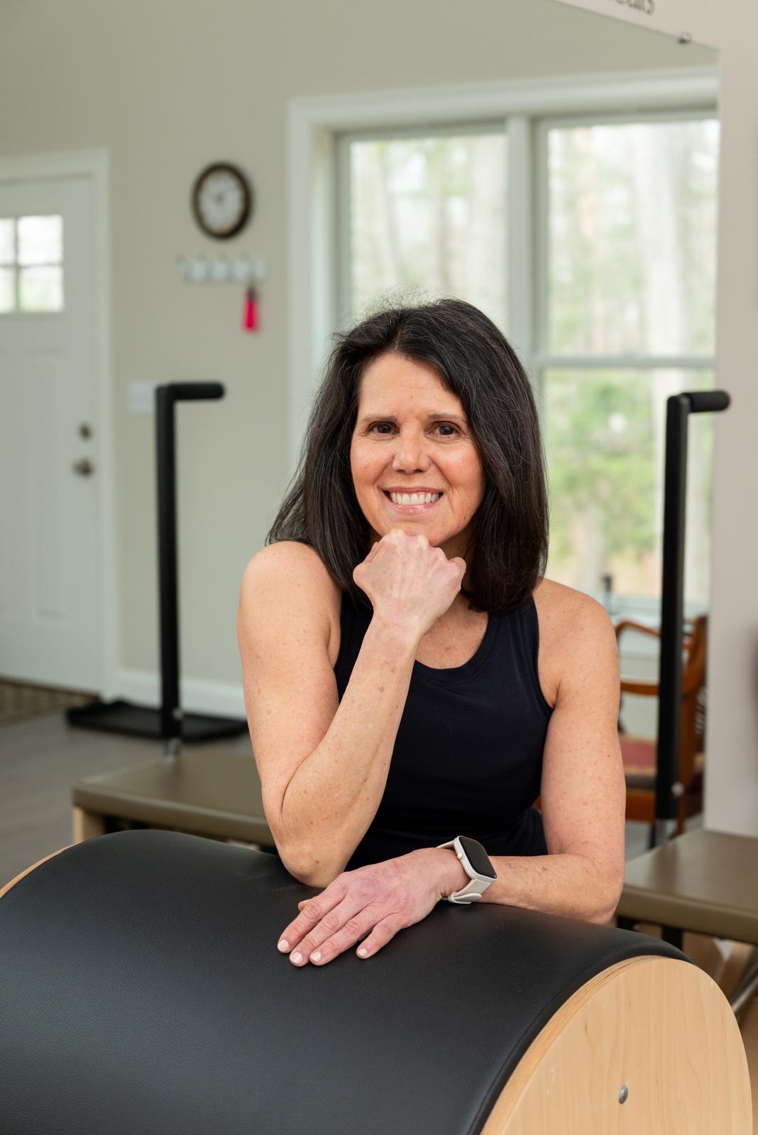 Portrait of Monica, owner and lead instructor of Flux Pilates